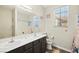 Bathroom with double sinks, granite countertop, large mirror, and custom seashell-themed décor at 5832 Ivy Vine Ct, Las Vegas, NV 89141