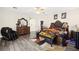 Spacious main bedroom features a sitting area, ornate furniture, and a ceiling fan at 5832 Ivy Vine Ct, Las Vegas, NV 89141