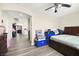 Bedroom with wood floors and neutral paint at 5832 Ivy Vine Ct, Las Vegas, NV 89141
