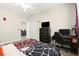 A bedroom featuring laminate floors, a closet, and a window with blinds and Spider-Personal decor at 5832 Ivy Vine Ct, Las Vegas, NV 89141