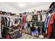 Walk-in closet filled with clothing and accessories on ample shelving and racks at 5832 Ivy Vine Ct, Las Vegas, NV 89141