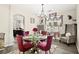 Dining room with chandelier lighting, set table, and large window at 5832 Ivy Vine Ct, Las Vegas, NV 89141