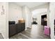 Hallway with gray wood floors and built-in cabinets at 5832 Ivy Vine Ct, Las Vegas, NV 89141