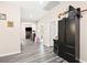 Hallway with gray wood floors leading to other rooms at 5832 Ivy Vine Ct, Las Vegas, NV 89141