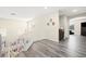 Spacious upstairs hallway with gray wood floors and natural light at 5832 Ivy Vine Ct, Las Vegas, NV 89141