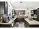 Well-equipped kitchen featuring granite countertops, black cabinets, and stainless steel appliances at 5832 Ivy Vine Ct, Las Vegas, NV 89141