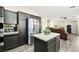 Open kitchen with an island view to the living room with stainless steel appliances at 5832 Ivy Vine Ct, Las Vegas, NV 89141