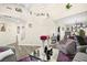 Bright living room with a soaring ceiling, wood floors, and view of the staircase at 5832 Ivy Vine Ct, Las Vegas, NV 89141