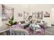 Bright living room with a large sectional couch, plants and modern decor at 5832 Ivy Vine Ct, Las Vegas, NV 89141