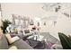 Bright living room with a large sectional couch, plants and modern decor at 5832 Ivy Vine Ct, Las Vegas, NV 89141
