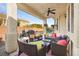 Outdoor patio area featuring a ceiling fan and ample seating for outdoor entertaining and access to the pool at 5832 Ivy Vine Ct, Las Vegas, NV 89141