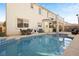 Inviting backyard oasis featuring a pool, patio, and ample space for outdoor entertaining surrounded by lush greenery at 5832 Ivy Vine Ct, Las Vegas, NV 89141