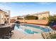 Sparkling backyard pool offers a refreshing escape with ample space for seating and entertaining amid manicured landscaping at 5832 Ivy Vine Ct, Las Vegas, NV 89141