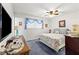 Inviting bedroom with calming blue accents, a ceiling fan, and lots of natural light at 5921 Halifax Ave, Las Vegas, NV 89107