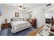 Cozy bedroom featuring a queen-sized bed, ceiling fan, and a mirrored closet at 5921 Halifax Ave, Las Vegas, NV 89107
