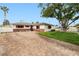 Charming single-story home featuring a well-manicured lawn and brick driveway at 5921 Halifax Ave, Las Vegas, NV 89107