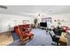 Spacious living room with plush red seating and ample space for relaxing and entertaining at 5921 Halifax Ave, Las Vegas, NV 89107