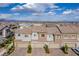 Aerial view of townhomes with neat landscaping, driveways, and garages at 6150 Foxes Dale St, Las Vegas, NV 89166