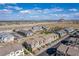 Comprehensive aerial view displaying community amenities, roadways and mountain views at 6150 Foxes Dale St, Las Vegas, NV 89166