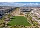 Aerial view of a community park with a playground and green space surrounded by homes at 6150 Foxes Dale St, Las Vegas, NV 89166