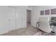 Comfortable bedroom area showcasing a desk, and view of a closet at 6150 Foxes Dale St, Las Vegas, NV 89166