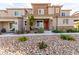 Inviting townhome featuring an attractive rock front yard at 6150 Foxes Dale St, Las Vegas, NV 89166