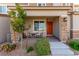 Charming front porch of a townhome with seating area at 6150 Foxes Dale St, Las Vegas, NV 89166