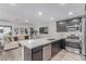 Modern kitchen features stainless steel appliances, ample counter space, and open floor plan at 6150 Foxes Dale St, Las Vegas, NV 89166