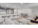 Bright open-concept living space with modern decor and furniture at 6150 Foxes Dale St, Las Vegas, NV 89166
