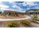 The inviting community playground features modern equipment, shaded picnic areas, and cheerful landscaping for Gathering enjoyment at 6150 Foxes Dale St, Las Vegas, NV 89166