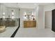 Bright bathroom featuring a glass walk-in shower, vanity and decorative lighting at 62 Incline Village Ct, Henderson, NV 89074