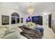 Spacious primary suite with an open layout, dark accent wall, large windows, and modern décor at 62 Incline Village Ct, Henderson, NV 89074
