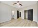 Bedroom with hardwood floors, ceiling fan, bathroom, and closet at 62 Incline Village Ct, Henderson, NV 89074
