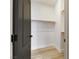 Walk-in closet featuring hardwood floors, multiple shelves and hanging storage, and a modern design at 62 Incline Village Ct, Henderson, NV 89074