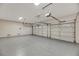 This bright garage has two doors, overhead lighting, and a clean epoxy floor, adding functionality and style at 62 Incline Village Ct, Henderson, NV 89074