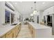 Open concept kitchen features stainless appliances and a large island at 62 Incline Village Ct, Henderson, NV 89074