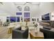 Bright living room boasts high ceilings, fireplace, and expansive windows with great natural light at 62 Incline Village Ct, Henderson, NV 89074