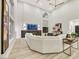 Bright living room with soaring ceilings, large windows, fireplace and neutral decor, and a modern aesthetic at 62 Incline Village Ct, Henderson, NV 89074