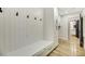 Mudroom with built-in bench, storage, and hooks for organization at 62 Incline Village Ct, Henderson, NV 89074