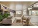 Relaxing covered patio area with comfortable seating, providing an ideal space for outdoor entertaining and relaxation at 62 Incline Village Ct, Henderson, NV 89074
