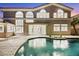 Stunning backyard view showcasing a sparkling pool, elegant architecture, and seamless indoor-outdoor living at 62 Incline Village Ct, Henderson, NV 89074