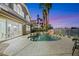 Enjoy a heated pool with a waterfall feature in a backyard made for entertaining and relaxation at 62 Incline Village Ct, Henderson, NV 89074