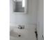 Bathroom featuring a white sink and a mirror reflecting the shower at 621 Van Ert Ave, North Las Vegas, NV 89030
