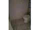 Bathroom featuring a toilet, tiled floor, and partial view of a tub at 621 Van Ert Ave, North Las Vegas, NV 89030