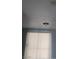 Bedroom ceiling with a modern light fixture and bright window at 621 Van Ert Ave, North Las Vegas, NV 89030