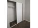 Bedroom closet featuring sliding doors, rod for hanging clothes, and carpeted flooring at 621 Van Ert Ave, North Las Vegas, NV 89030