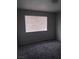 Bedroom featuring neutral walls, carpet, and a window with blinds at 621 Van Ert Ave, North Las Vegas, NV 89030