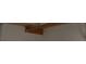 An empty closet features a clothes rod and shelving at 621 Van Ert Ave, North Las Vegas, NV 89030