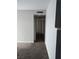 A hallway with tan paint, off white trim, and carpet at 621 Van Ert Ave, North Las Vegas, NV 89030