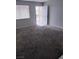 Spacious living room with plush carpeting and a bright, welcoming atmosphere at 621 Van Ert Ave, North Las Vegas, NV 89030